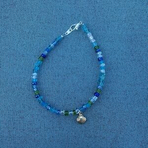 Blue Beaded Bracelet with Shell Charm